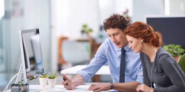 young-business-professionals-discussing-work-documents-1.jpg